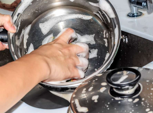 Clean stainless steel cookware drying after washing, showing its hygienic and easy to clean Clean stainless steel cookware drying after washing, showing its hygienic and easy to clean