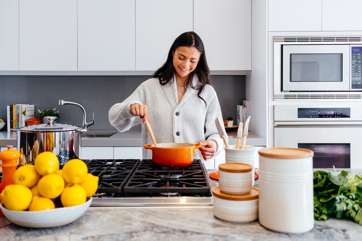 Hard anodized aluminum skillet versus stainless steel skillet side-by-side comparison on kitchen counter