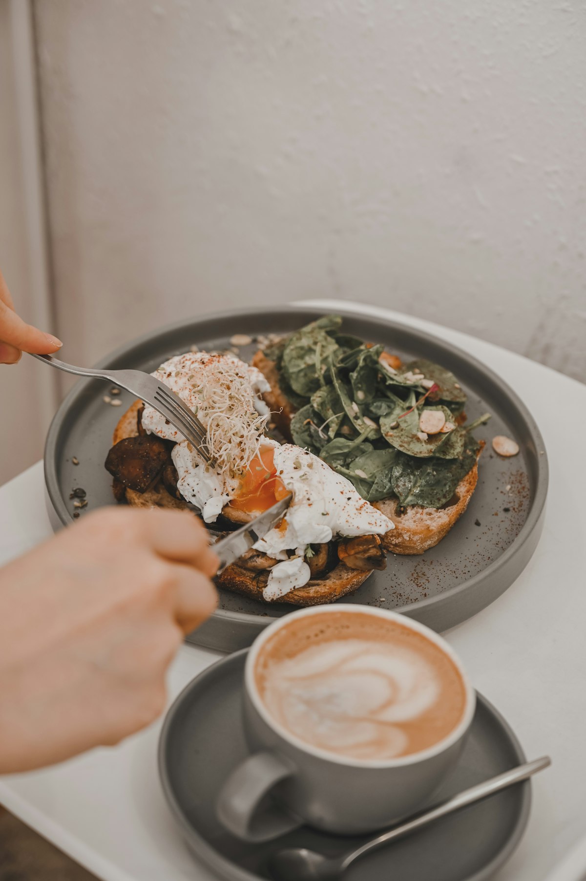 Using silicone spatula to gently release food from stainless steel pan without scraping the surface