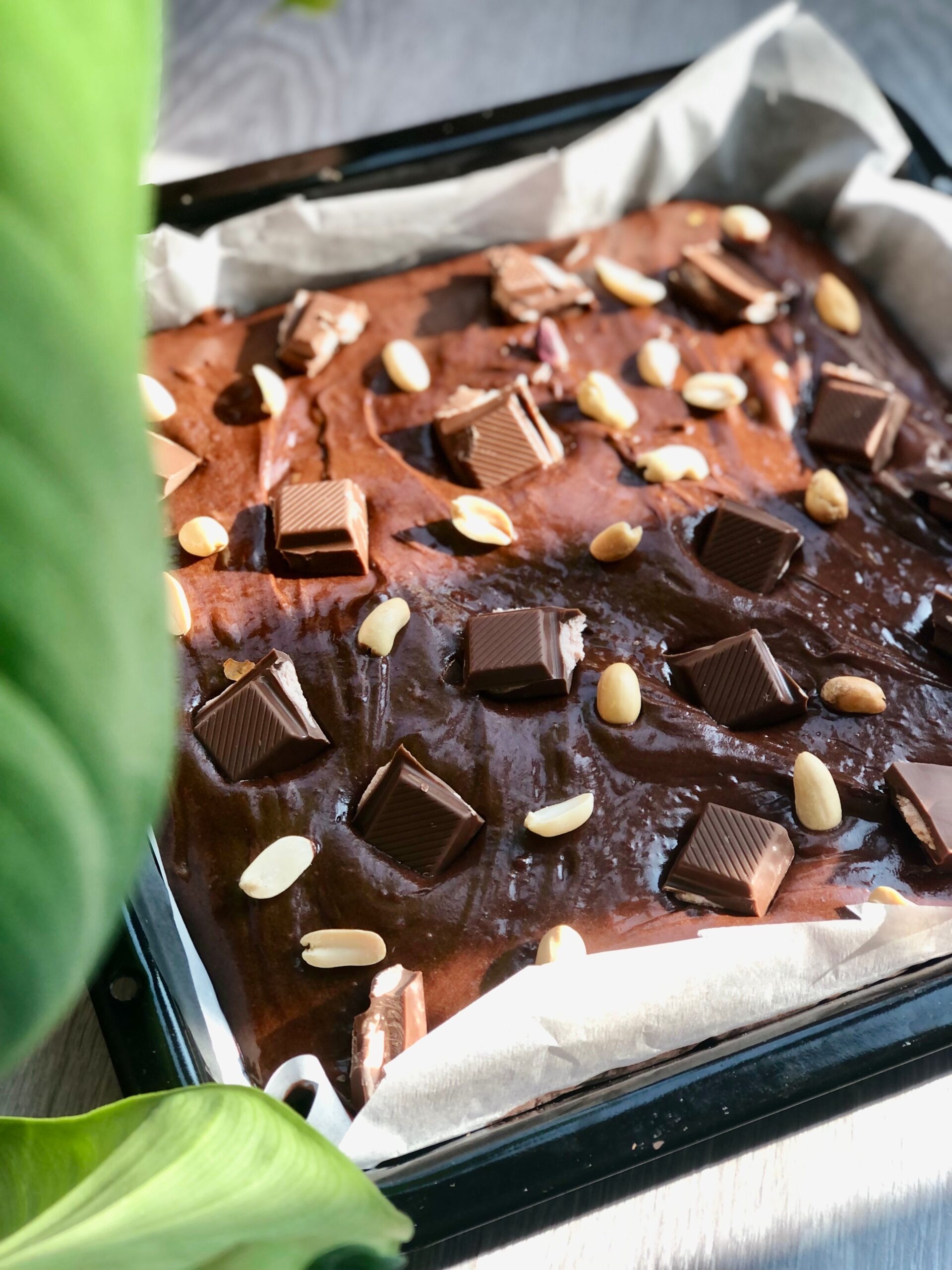 Perfectly baked brownies with caramelized edges in a metal baking pan - demonstrating browning from direct heat contact