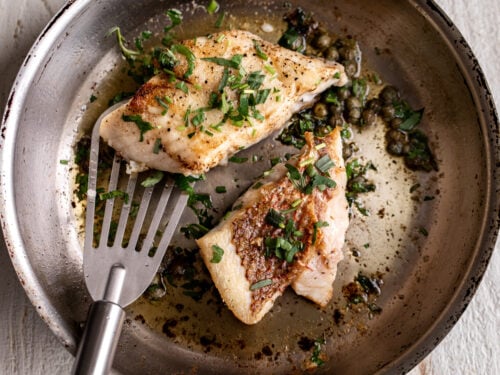 skinless cod fillet cooking in stainless steel pan showing proper technique for white fish without skin - medium heat