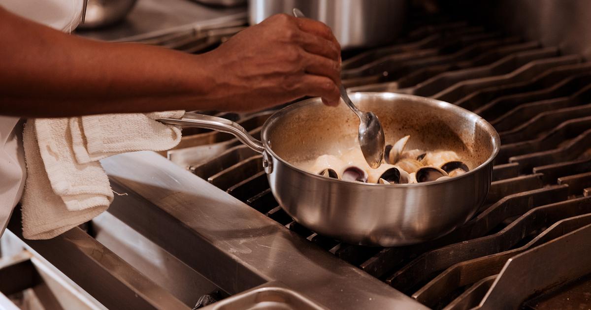 Stainless steel cookware pitting corrosion close-up - surface damage from acidic cooking salt water - grade comparison 304 vs 430