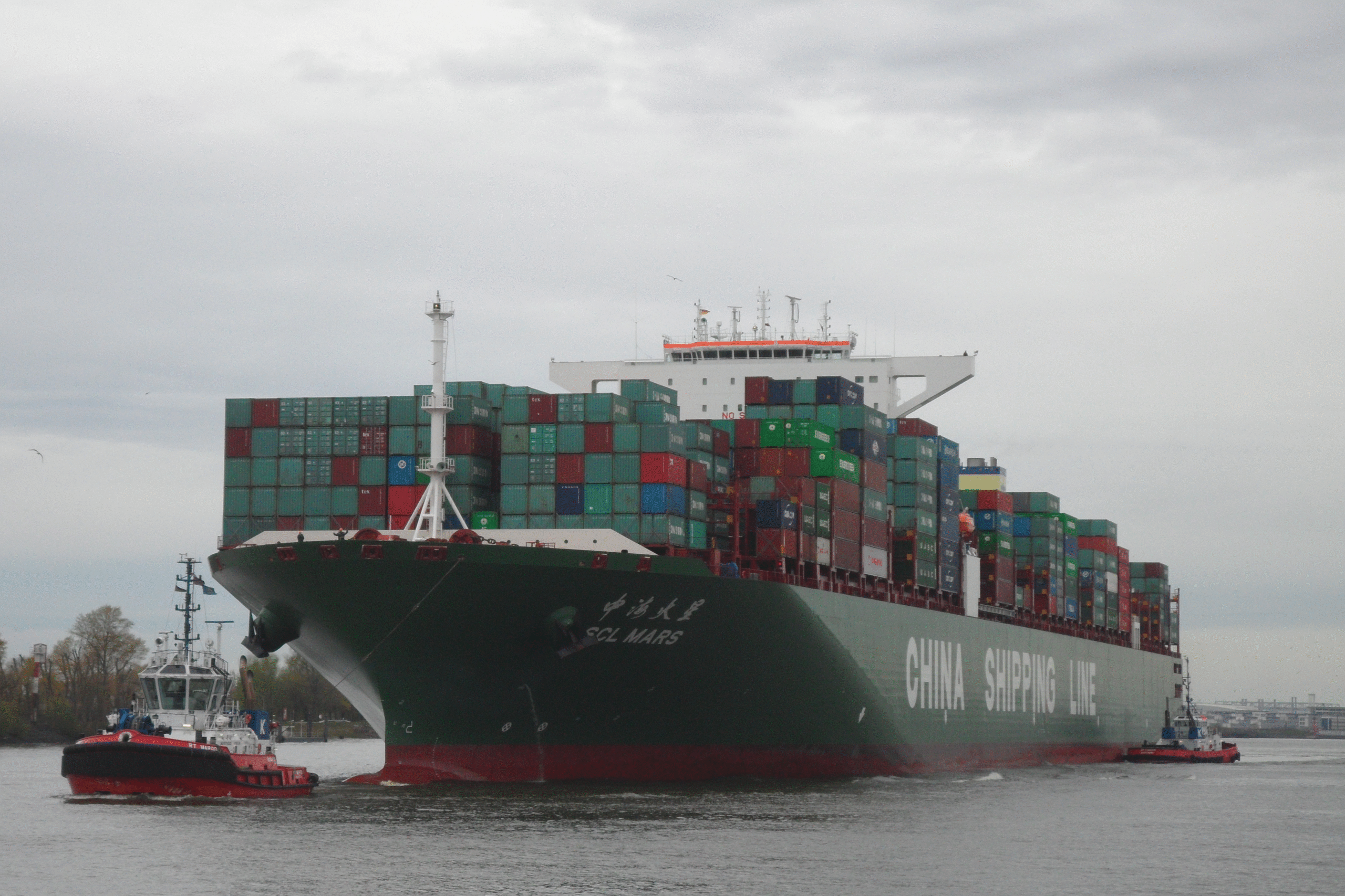 China CSCL container ship loaded with cargo containers at port - sea freight shipping from China to international markets